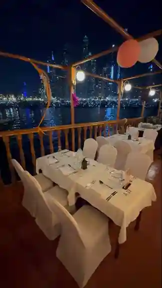 Scenic view of dubai’s skyline during a dhow cruise party event at twilight